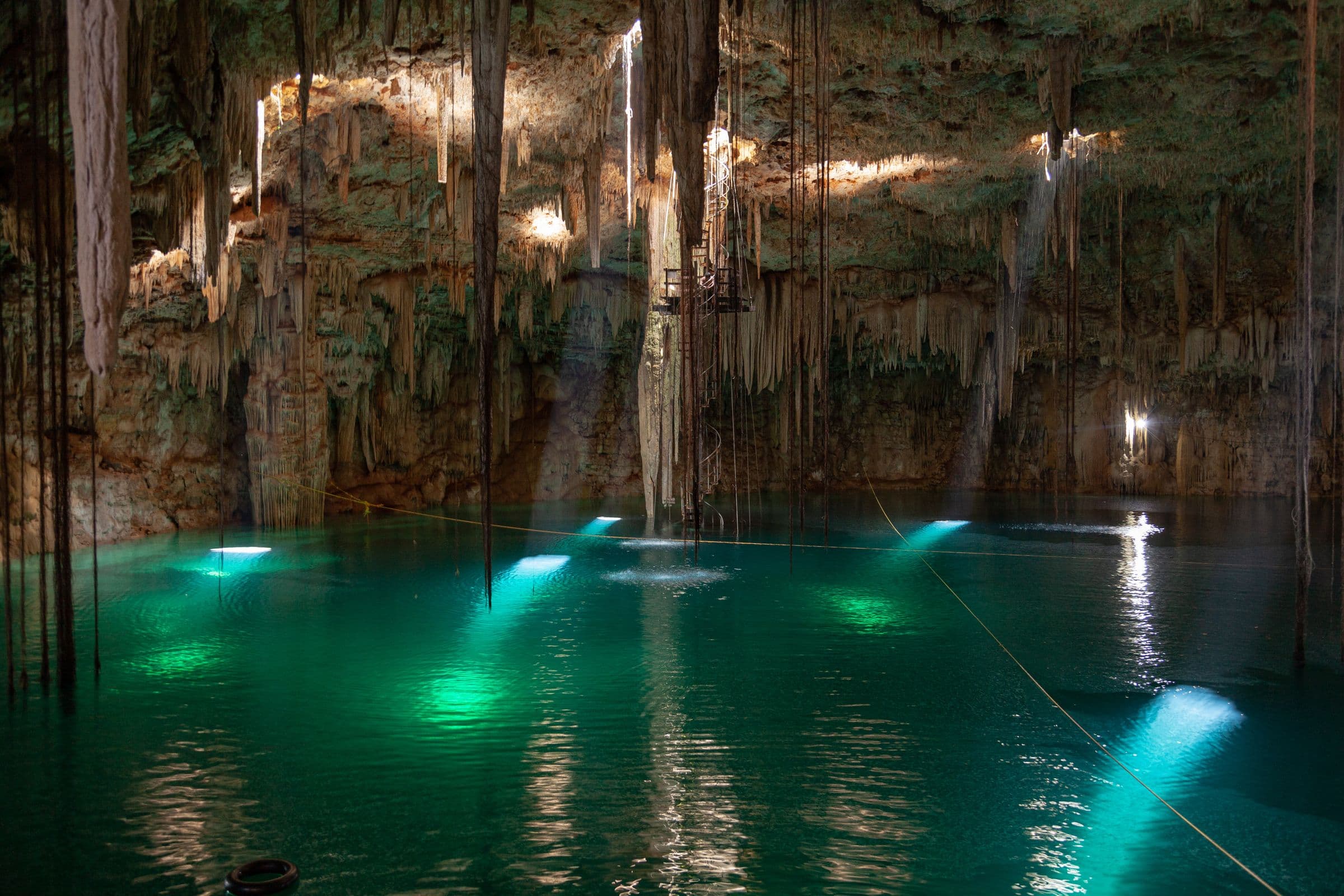 Open-air cenote with vivid turquoise water in Yucatán