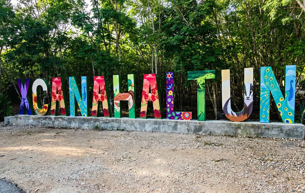 Entrance sign at Cenote Xcanahaltun in the Yucatán countryside