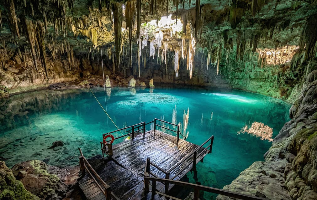 Wooden platform overlooking the cave pool at Cenote Xcanahaltun